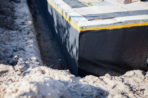 Professional Waterproofing technician working in Covington, KY